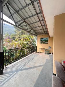 a balcony with a view of the mountains at Villa Pondok Aurora in Campaka