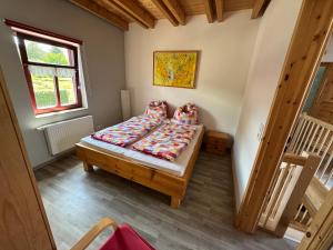 a small bedroom with a bed in a room at Café Landart im Thüringer Finistère in Plaue +75 photos