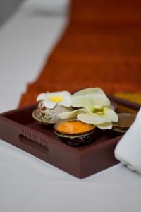 a plate of food with flowers on top of it at The Spring Bangkok in Bangna +30 photos