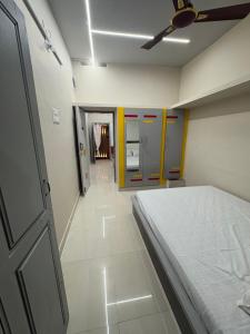 a hospital room with a bed and a ceiling at vMAC in Thiruchendur +3 photos