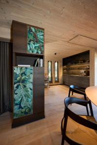 a living room with a large painting on the wall at Exklusive Ferienlodge in Wertheim