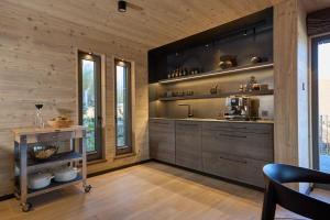 a kitchen with wooden walls and wooden flooring at Exklusive Ferienlodge in Wertheim