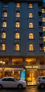 a hotel with two cars parked in front of it at SPOR HOTEL in Ankara