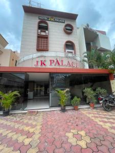 a building with a sign on the front of it at Hotel JK Palace Newly Renovate in Shirdi