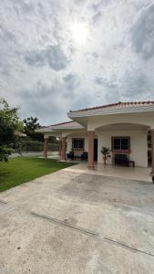a large building with a patio in front of it at Villa azuero in Los Santos