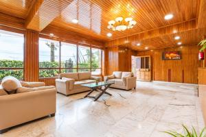 a living room with wood paneling and a table at Sparrow Chiminda A-Heritage Hotel Middle Pelling in Pelling