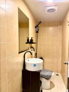 a bathroom with a sink and a toilet at Simply Stay Chaweng in Chaweng +38 photos