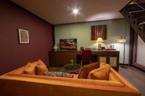 a living room with a couch and a table at Inpeng View Hotel in Vientiane