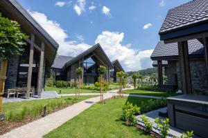 a garden in front of a house at Monte SPA Villas in Banya