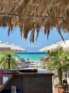 a view of the beach from a restaurant with the ocean at Best location in Vrachati in Vrachati