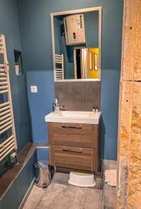a bathroom with a sink and a mirror at Maison Wilson - Dijon centre - very quiet in Dijon +25 photos