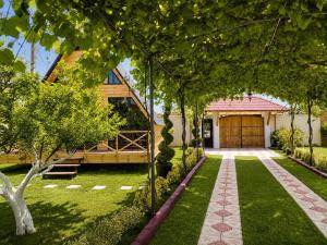 a house with a garden with a walkway at Cappadociagarden in Kutaisi
