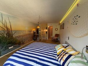 a bedroom with a bed with a view of the ocean at Nyons Riviera in Nyons