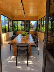 a large dining room with a large wooden table and chairs at Cappadociagarden in Kutaisi