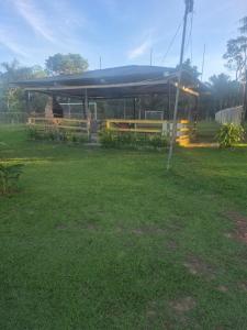 a shelter in a park with a grass field at chacara cheiro da mata in Manacapuru +14 photos