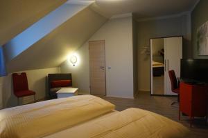 Säng eller sängar i ett rum på Hotel-Restaurant Große-Wilde