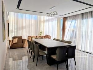 a dining room with a table and chairs at Riva guest house in Antananarivo