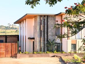 a house with a fence in front of it at Riva guest house in Antananarivo