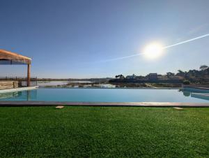 a swimming pool with a view of the water at Riva guest house in Antananarivo