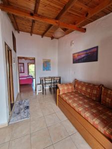 a living room with a couch and a table at Cozy apartment with a great view! R in Metamorfosi
