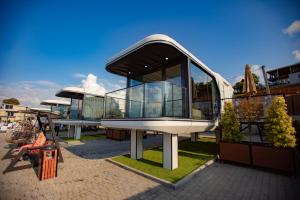 a glass building sitting on top of a building at Mars Oasis Capsule in Charnali