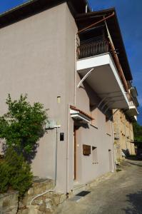 a building with a balcony on the side of it at D6 Lake View in Kastoria