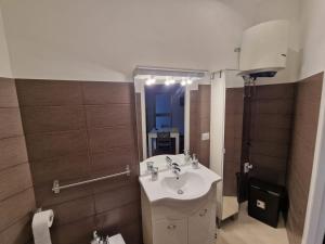a bathroom with a sink and a mirror at B&B da Francesco Centro Loc. Turistica in Ruvo di Puglia