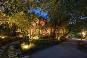 a house with lights in front of it at night at Dreaming Retreat Da Lat in Ấp An Kroët +20 photos