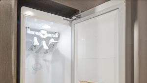 a sliding glass door with a skateboard on the wall at HOTEL lantana in Tudomi