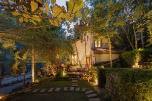 a house with lights in front of a yard at Dreaming Retreat Da Lat in Ấp An Kroët