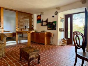a room with a kitchen with a table and a chair at Eco Residence Rokotovi in Stari Grad +32 photos