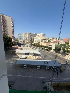 a view of a parking lot with a large building at torremolinos centro parking privado in Torremolinos