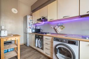 a kitchen with a washer and a washing machine at Da Chiara in Pistoia