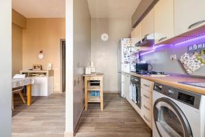 a kitchen with a washer and dryer in a room at Da Chiara in Pistoia