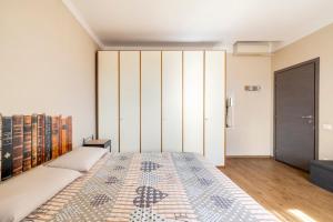 a bedroom with a large bed and a closet at Da Chiara in Pistoia