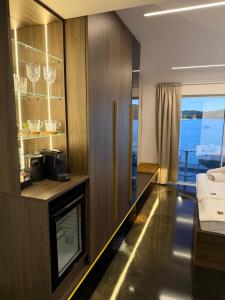 a hotel room with a bed and a television at Hotel BOUTIQUE in Tisno