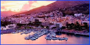 a group of boats docked in a harbor in a city at Casa mediterranea in Formia