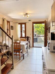 a kitchen and dining room with a table at Diamanti Stone House in Lafiónas