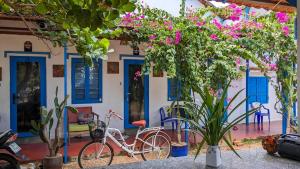 a house with two bikes parked in front of it at Phu Yen Beachfront Fishing Village Homestay in Tuy Hoa