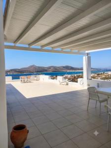 a view from the patio of a house with a view of the ocean at Minos Villa Antiparos in Antiparos