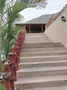 a set of stairs leading up to a building at Casa Reyna in Hacienda Cienguilla
