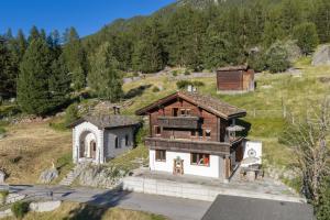 a small house on top of a hill at Waldnest in Grächen