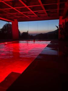 a room with red lights on the floor at Domus Otium in Atena Lucana