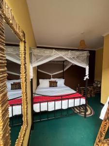 a bedroom with two bunk beds and a mirror at Balletto Boutique in Arusha