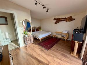 a bedroom with a bed and a mirror at The Jaffa Roof in Tel Aviv