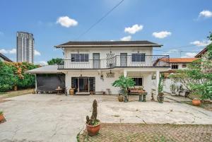 a house with a large courtyard in front of it at Sugar Houz ruum2 in Johor Bahru +14 photos
