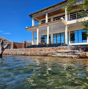a house from the water in front at Nyanja Cottage in Chembe