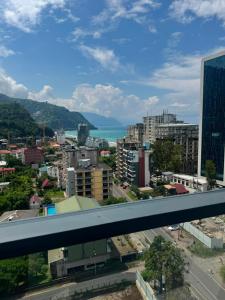 a view of a city with the ocean in the background at Thom Tower in Gonio +60 photos
