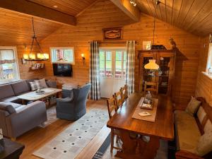 a living room with a couch and a table at Hansmoen in Bjorli