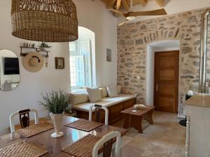 a living room with a table and a couch at Leonidas house hydra in Hydra